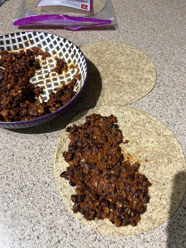 making bean quesadilla