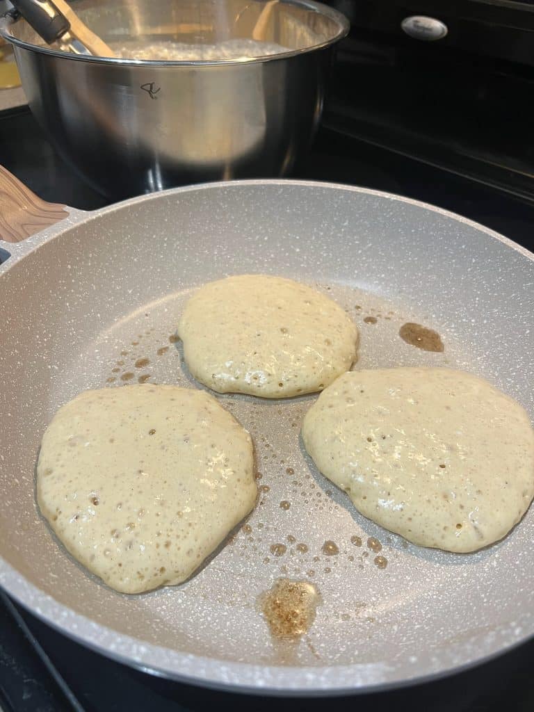 cottage cheese protein pancakes cooking in pan