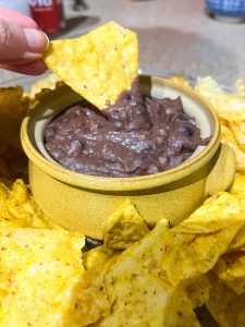 black bean dip recipe in yellow bowl