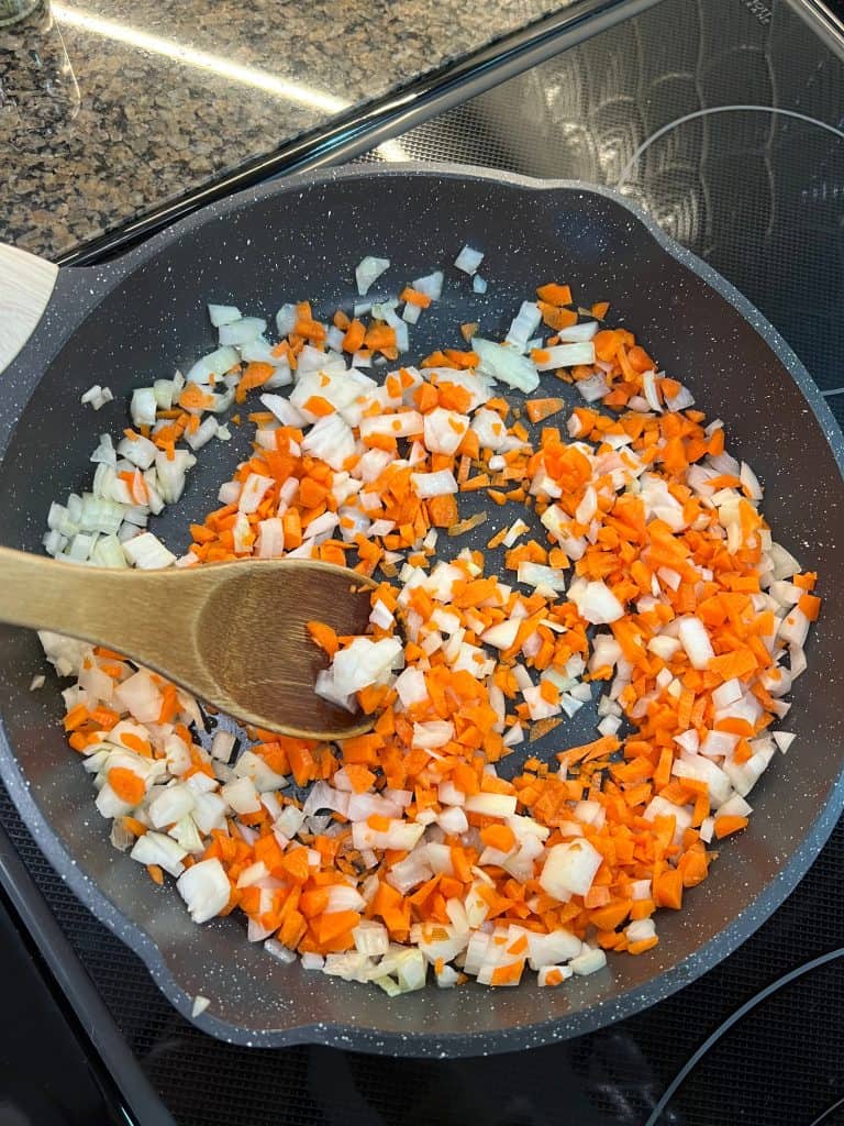 carrots and onions in pan