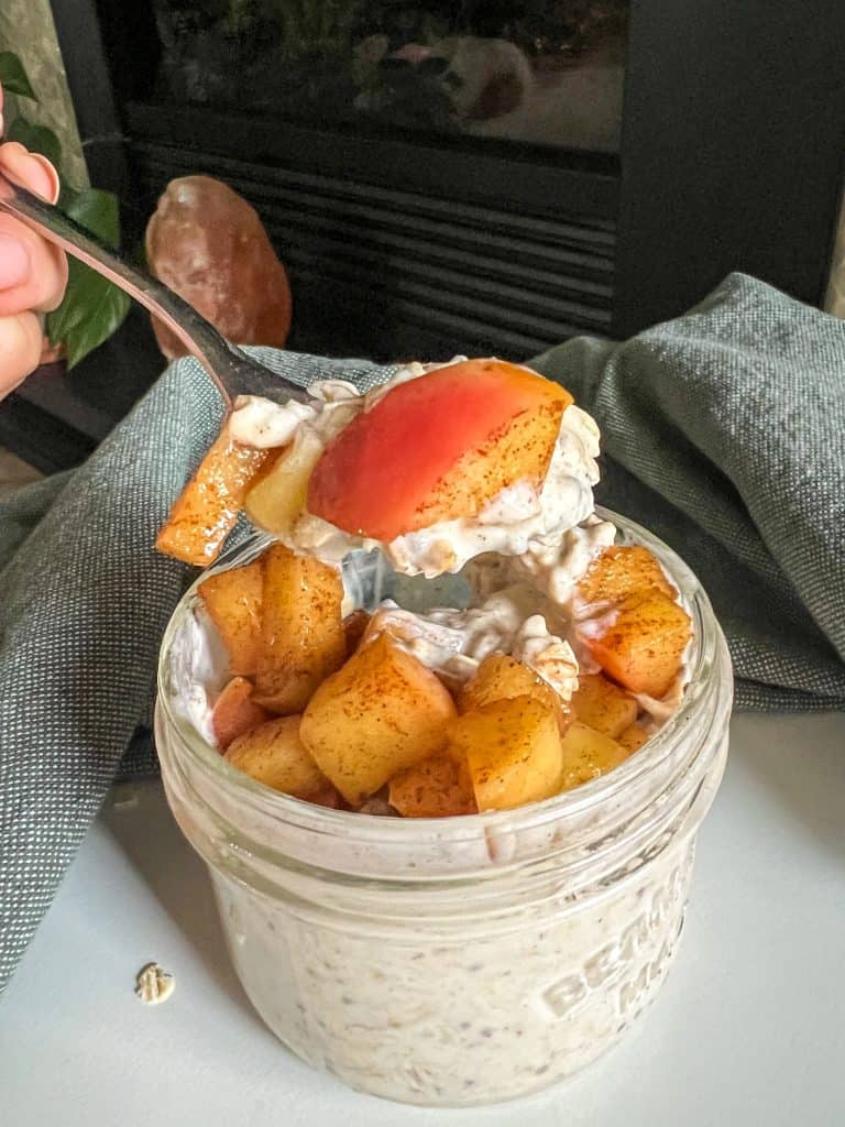 apple cinnamon overnight oats on spoon