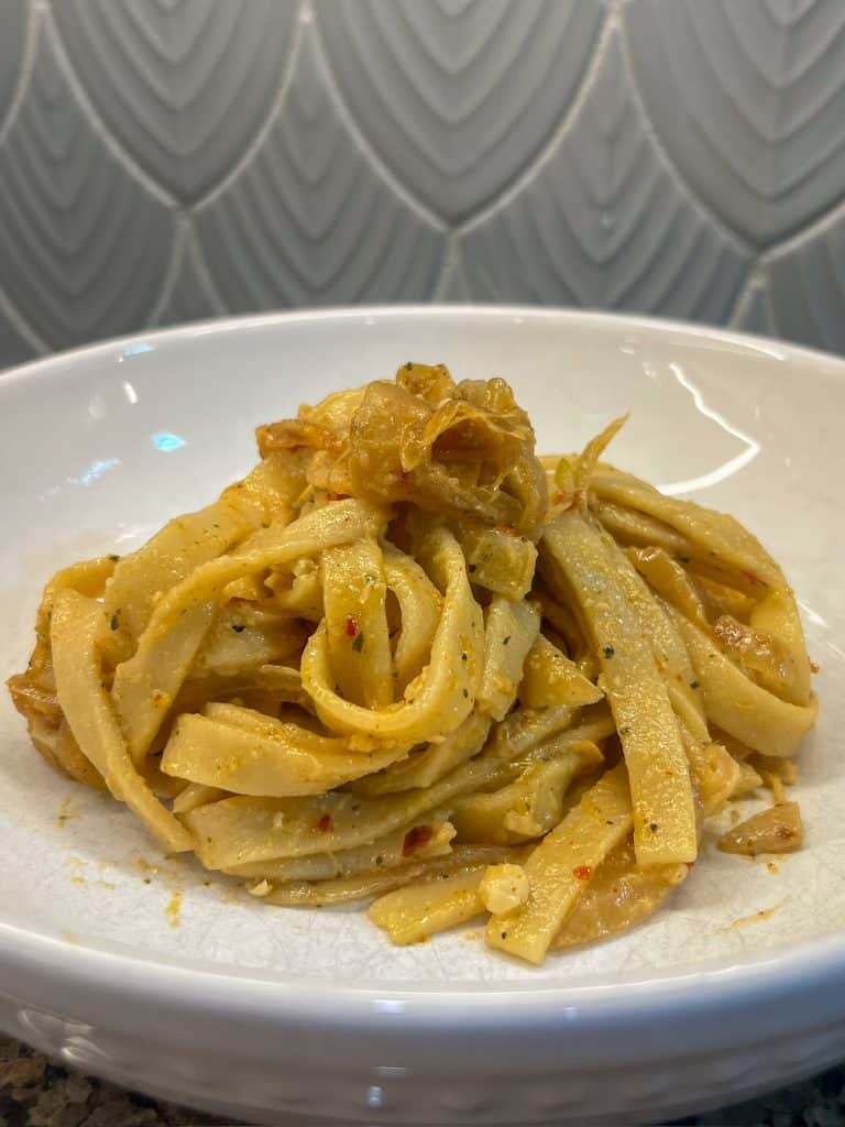 caramelized onion pasta in bowl vegan